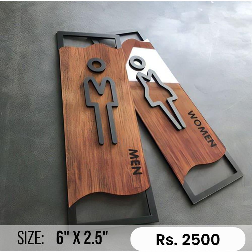 Custom wave-cut dark restroom sign